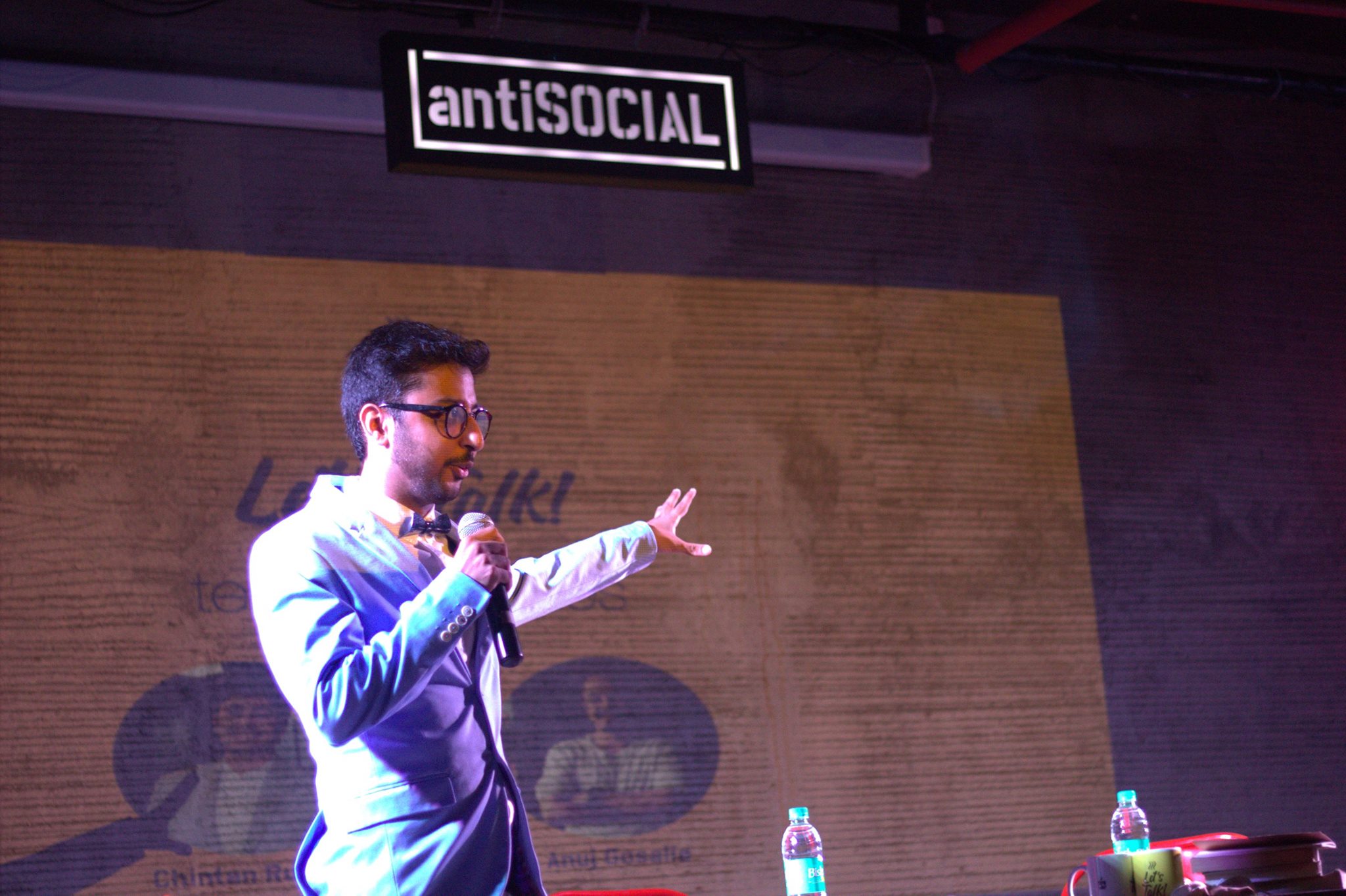 Priyesh Thakkar on stage at antiSOCIAL Mumbai hosting a Sip and Swap event